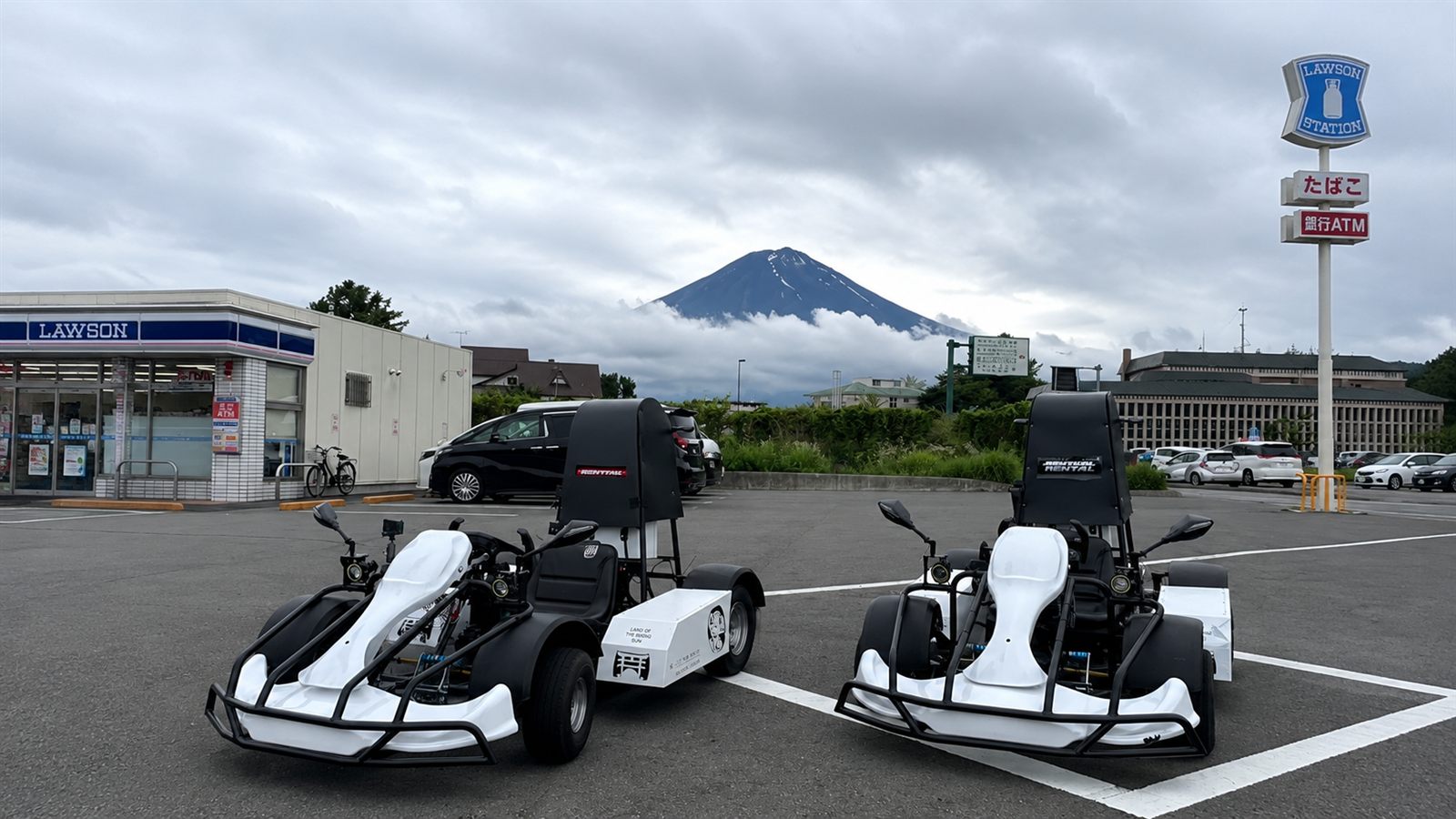 Electric go-karts parked with Mt. Fuji in the background